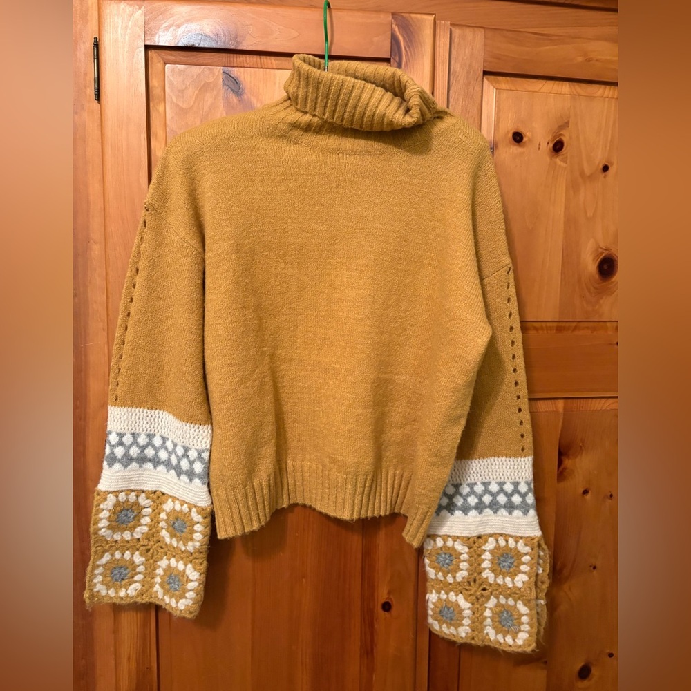 Soft mustard coloured turtleneck sweater with crochet bell sleeve
